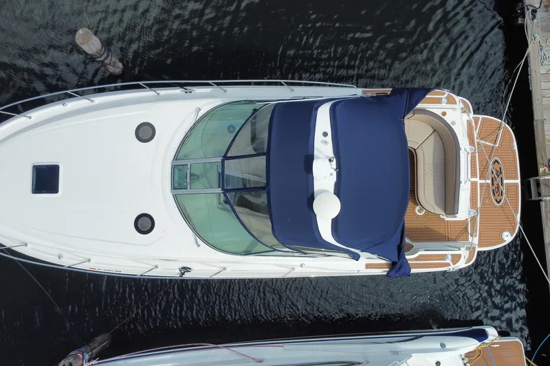 Slide: The Image of Top view of a 2002 Sea Ray 320 Sundancer yacht docked at a marina. - 46