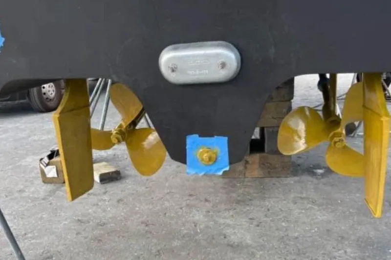 Slide: The Image of Rear view of 2002 Sea Ray 320 Sundancer with dual propellers and rudders. - 48