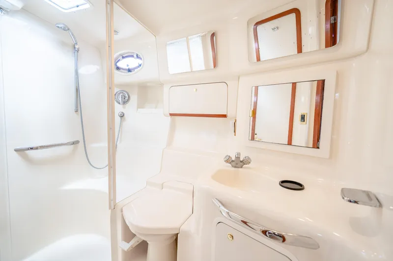 Slide: The Image of Luxurious bathroom in 1998 Sea Ray 450 Sundancer yacht with shower and sink. - 22
