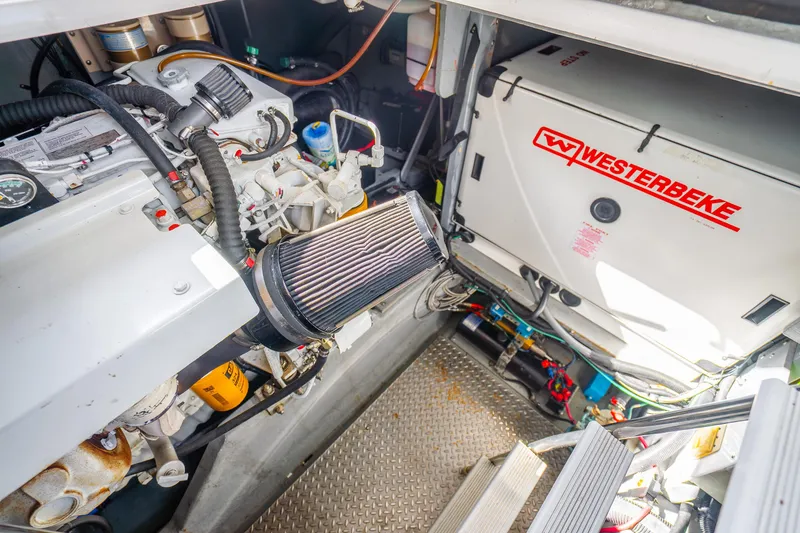 Slide: The Image of Engine room of 1998 Sea Ray 450 Sundancer with Westerbeke generator. - 34