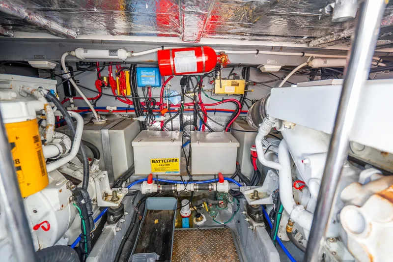 Slide: The Image of Engine room of 1998 Sea Ray 450 Sundancer with batteries and wiring. - 36