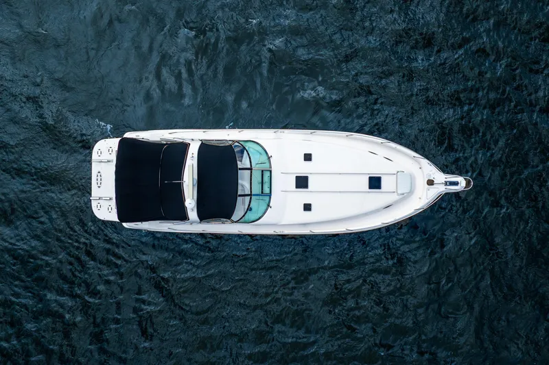Slide: The Image of Aerial view of 1998 Sea Ray 450 Sundancer yacht on open water. - 6