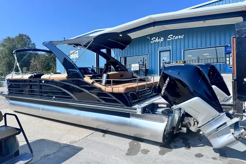 Slide: The Image of 2026 Bennington 27RSBAT2 pontoon boat with Mercury engines at a ship store. - 12