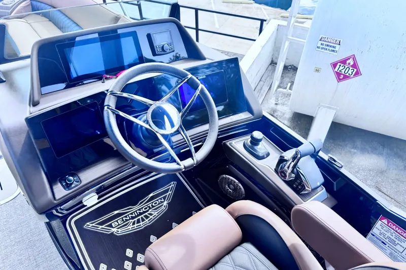 Slide: The Image of Interior of 2026 Bennington 27RSBAT2 boat with modern steering and control panel. - 7