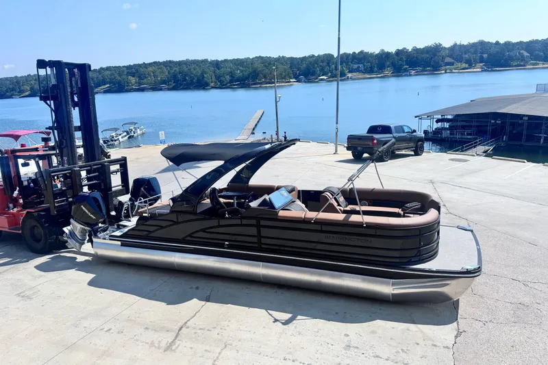 Slide: The Image of 2026 Bennington 27RSBAT2 pontoon boat on dock by scenic lake. - 9