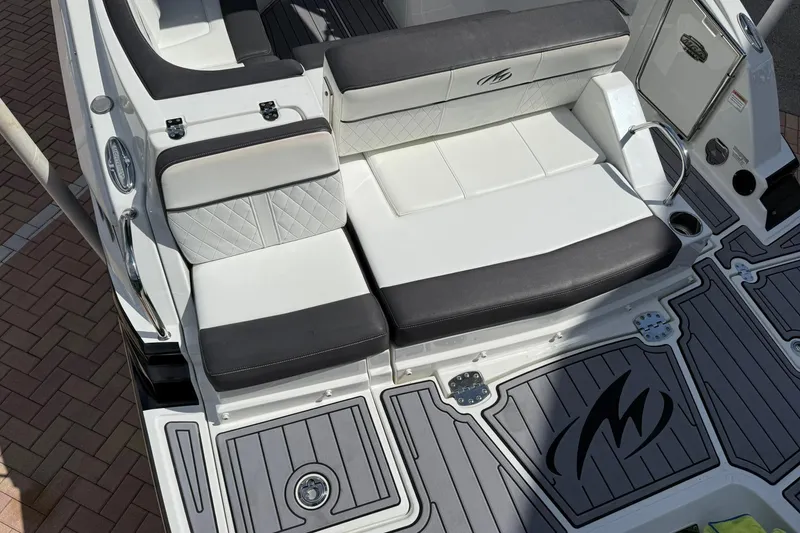 Slide: The Image of Luxury seating on 2018 Monterey M-65 boat with stylish black and white upholstery. - 19