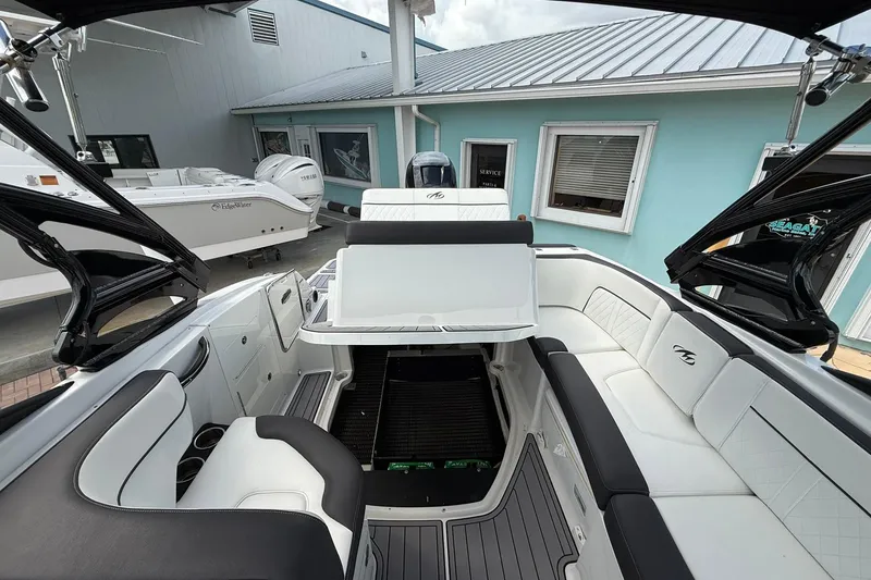 Slide: The Image of 2018 Monterey M-65 boat interior with white seating and modern design. - 29