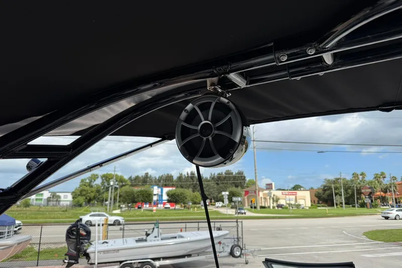 Slide: The Image of Boat speaker mounted on a 2018 Monterey M-65, with a street view in the background. - 33