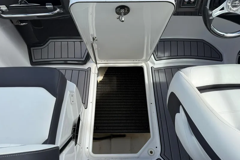 Slide: The Image of Interior of 2018 Monterey M-65 boat showing seating and storage compartment. - 36