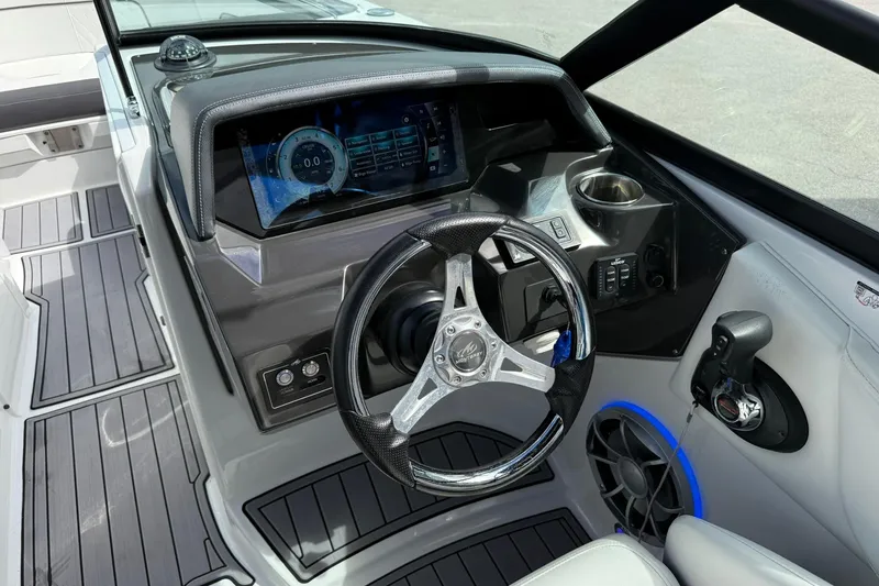 Slide: The Image of Cockpit of 2018 Monterey M-65 boat with modern steering wheel and digital dashboard. - 37