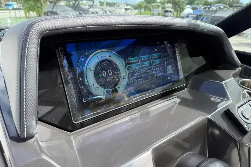 Slide: The Image of Dashboard of a 2018 Monterey M-65 boat with digital display and controls. - 38