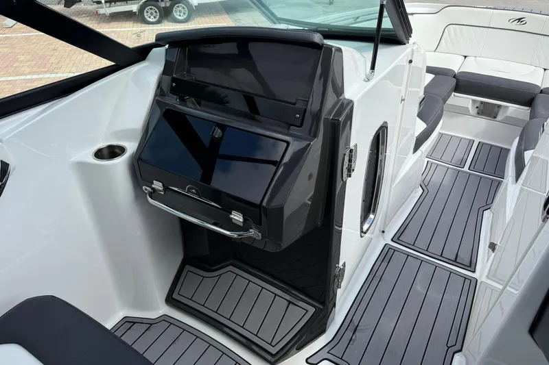 Slide: The Image of 2018 Monterey M-65 boat interior with sleek design and modern dashboard. - 39