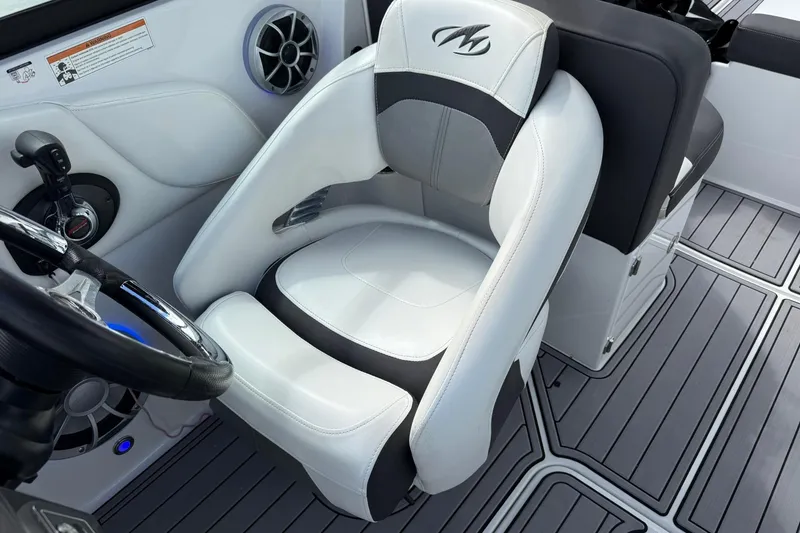 Slide: The Image of Captain's seat in a 2018 Monterey M-65 boat, featuring sleek design and modern controls. - 40