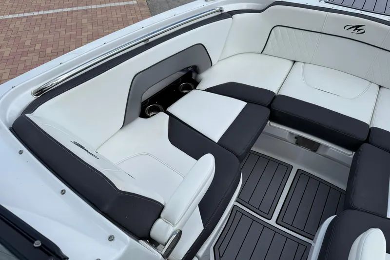 Slide: The Image of Luxurious seating area on a 2018 Monterey M-65 boat with black and white upholstery. - 44