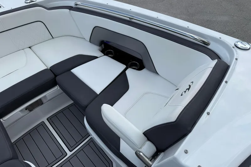 Slide: The Image of Luxurious seating in 2018 Monterey M-65 boat with sleek black and white upholstery. - 45