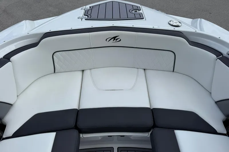 Slide: The Image of Luxury seating on a 2018 Monterey M-65 boat, featuring elegant white and black upholstery. - 46