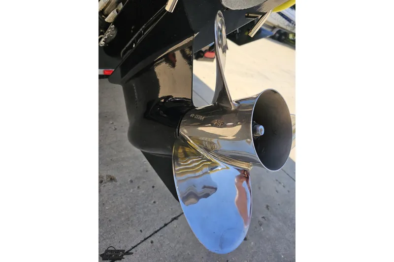 Slide: The Image of Close-up of a 2005 Baja 25 Outlaw boat propeller, shiny and metallic. - 34