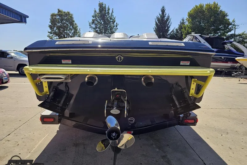 Slide: The Image of Rear view of a 2005 Baja 25 Outlaw boat with dual exhaust and propeller. - 35