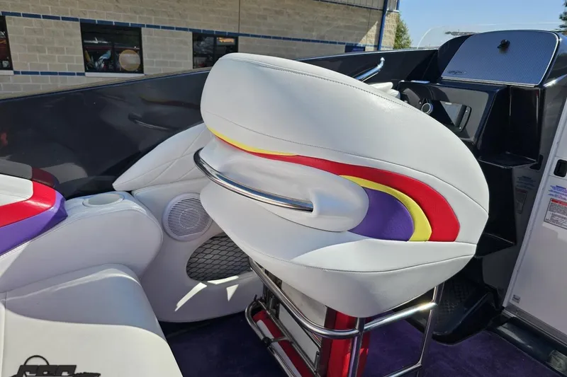 Slide: The Image of 2005 Baja 25 Outlaw boat interior with colorful seating and modern design. - 60