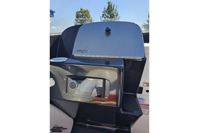 Slide: The Image of 2005 Baja 25 Outlaw boat dashboard with Fusion stereo system and speaker. - 65