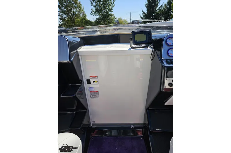 Slide: The Image of 2005 Baja 25 Outlaw boat cockpit with navigation equipment and gauges. - 71