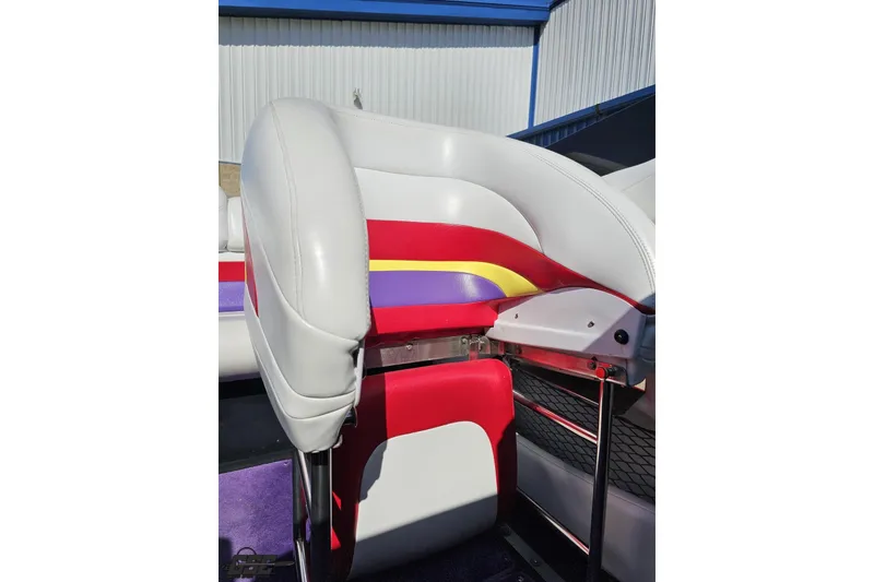 Slide: The Image of 2005 Baja 25 Outlaw boat seat with colorful upholstery design. - 87