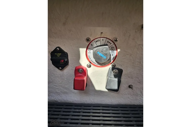 Slide: The Image of 2005 Baja 25 Outlaw boat battery switch and circuit breaker panel. - 92