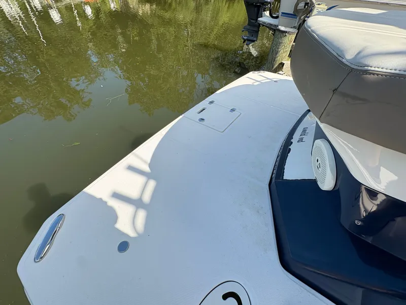 Slide: The Image of 2016 Regal 35 Sport Coupe boat deck near calm water. - 13