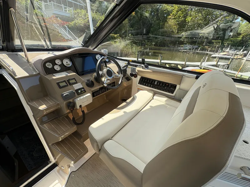 Slide: The Image of 2016 Regal 35 Sport Coupe helm with modern controls and comfortable seating. - 18