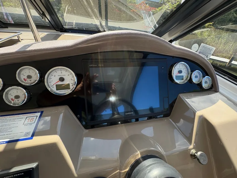 Slide: The Image of Dashboard of a 2016 Regal 35 Sport Coupe with gauges and Garmin GPS. - 25