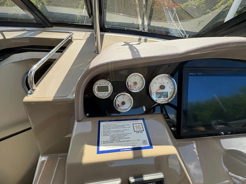 Slide: The Image of Dashboard of a 2016 Regal 35 Sport Coupe with gauges and Garmin display. - 26