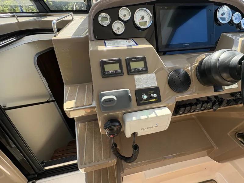 Slide: The Image of Control panel of a 2016 Regal 35 Sport Coupe with Garmin navigation system. - 27