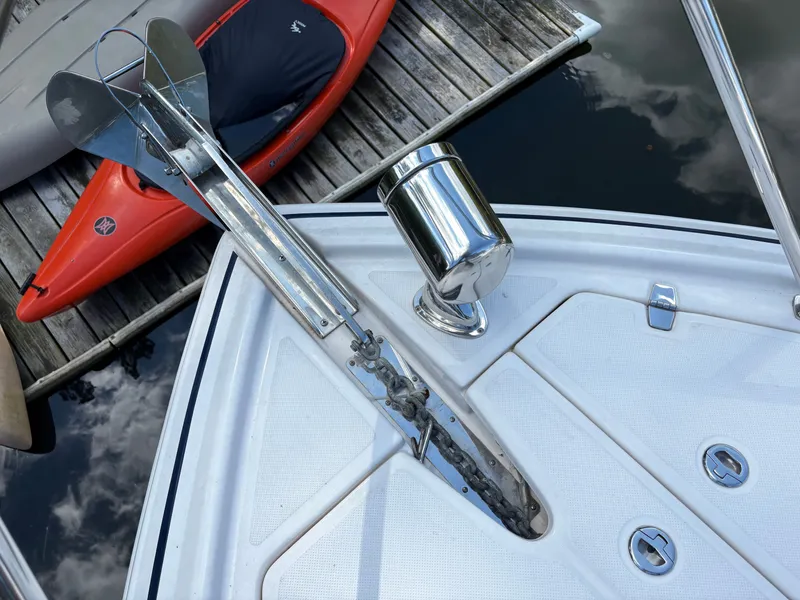 Slide: The Image of Bow of 2016 Regal 35 Sport Coupe with anchor and kayaks nearby. - 3
