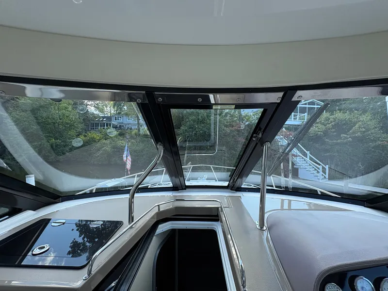Slide: The Image of Interior view of 2016 Regal 35 Sport Coupe yacht cockpit with scenic background. - 33
