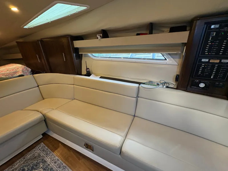 Slide: The Image of Interior of 2016 Regal 35 Sport Coupe with beige seating and control panel. - 35