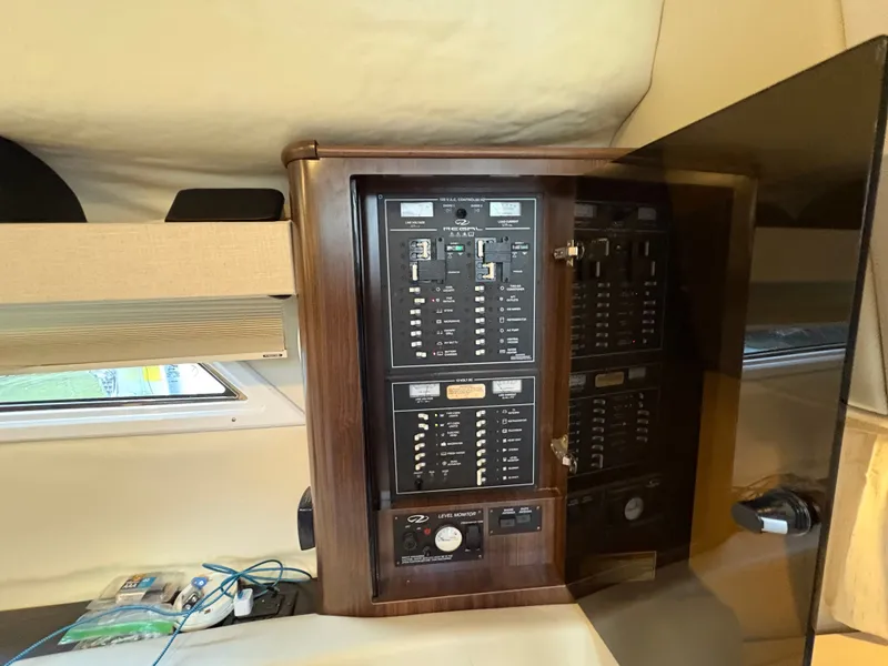 Slide: The Image of Electrical panel inside 2016 Regal 35 Sport Coupe boat cabin. - 36