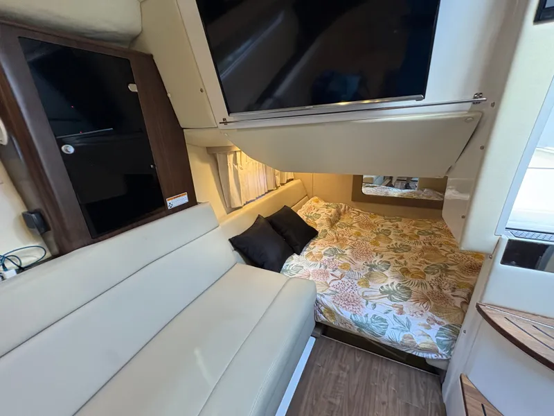 Slide: The Image of Interior of 2016 Regal 35 Sport Coupe with cozy bed and modern furnishings. - 46