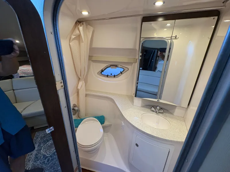 Slide: The Image of Bathroom interior of 2016 Regal 35 Sport Coupe with sink, toilet, and mirror. - 48