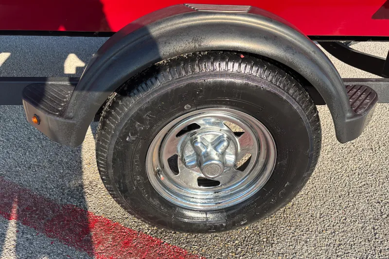 Slide: The Image of 2024 Bass Tracker XL boat with Mercury engine on trailer in parking lot. - 10