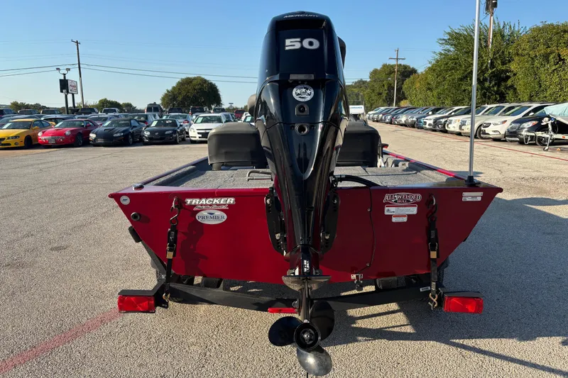 Slide: The Image of 2024 Bass Tracker XL with Mercury 50 horsepower engine in parking lot. - 14