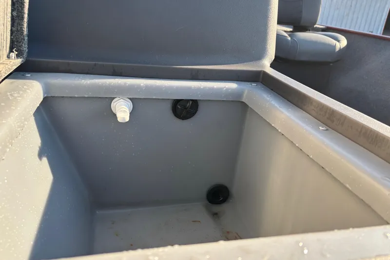 Slide: The Image of 2024 Bass Tracker XL boat dashboard with steering wheel and Lowrance GPS system. - 20