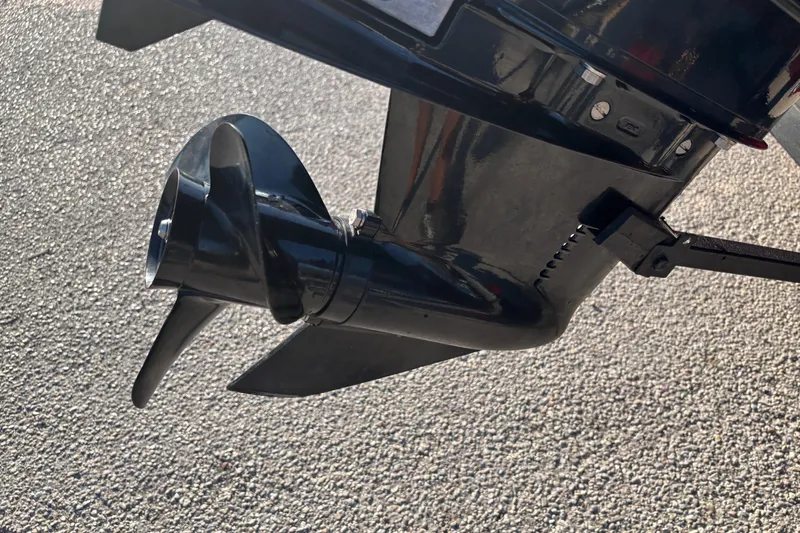 Slide: The Image of 2024 Bass Tracker XL boat interior with carpeted deck and rod holders. - 26