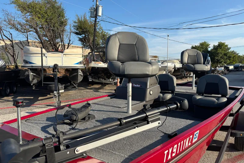 Slide: The Image of 2024 Bass Tracker XL boat on trailer with Minn Kota motor in marina. - 8