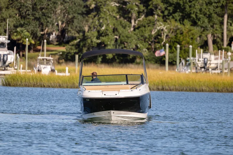 Slide: The Image of 2019 Sea Ray SDX 250 Outboard boat cruising on a scenic waterway. - 32