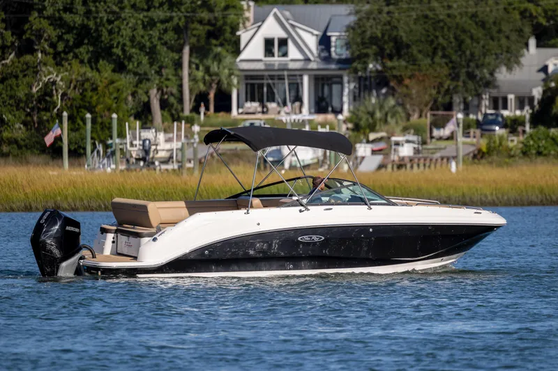 Slide: The Image of 2019 Sea Ray SDX 250 Outboard boat cruising on a scenic waterway. - 35