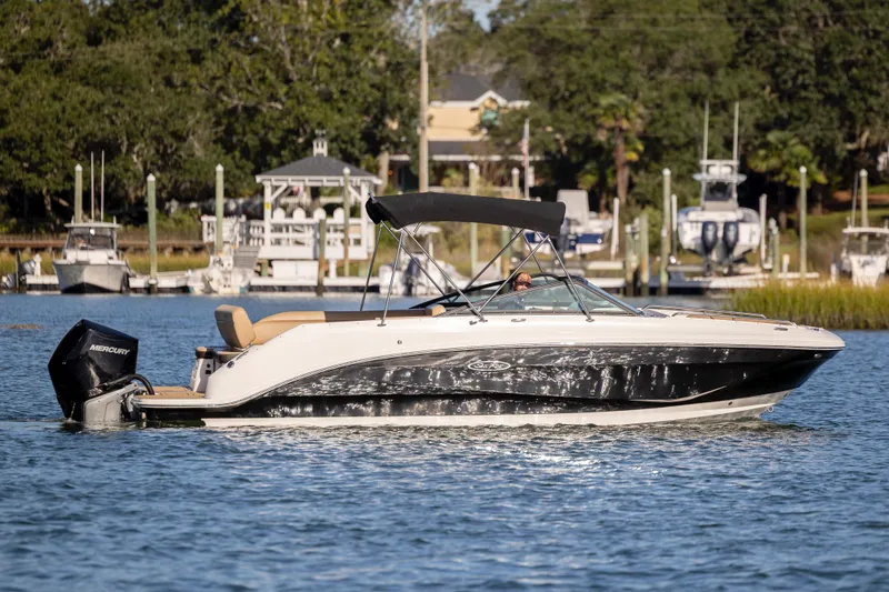 Slide: The Image of 2019 Sea Ray SDX 250 Outboard boat cruising on a sunny day. - 37