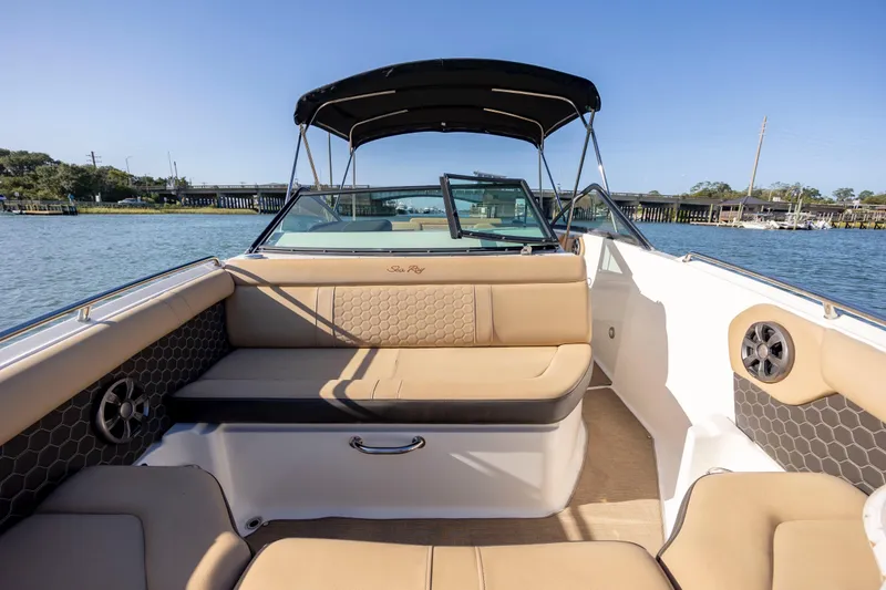 Slide: The Image of 2019 Sea Ray SDX 250 Outboard boat interior with tan seating and water view. - 41