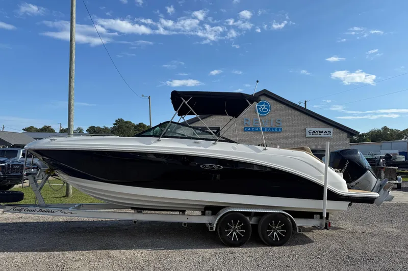Slide: The Image of 2019 Sea Ray SDX 250 Outboard boat on trailer at dealership. - 52
