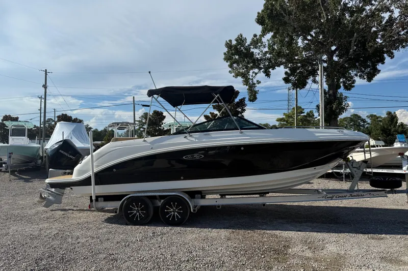 Slide: The Image of 2019 Sea Ray SDX 250 Outboard boat on trailer, parked outdoors. - 60