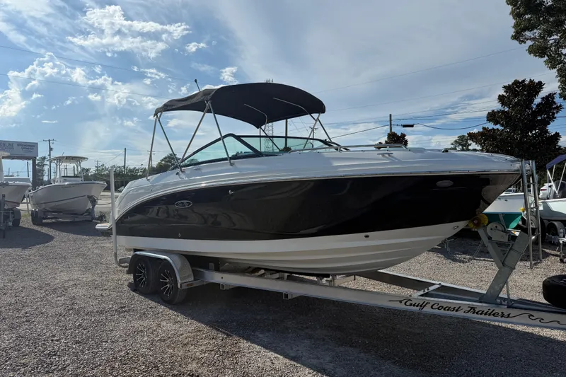Slide: The Image of 2019 Sea Ray SDX 250 Outboard boat on trailer under sunny sky. - 61